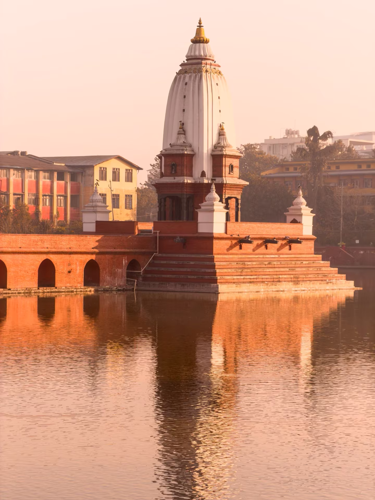 The white temple at the center of Rani Pokhari pond in Kathmandu