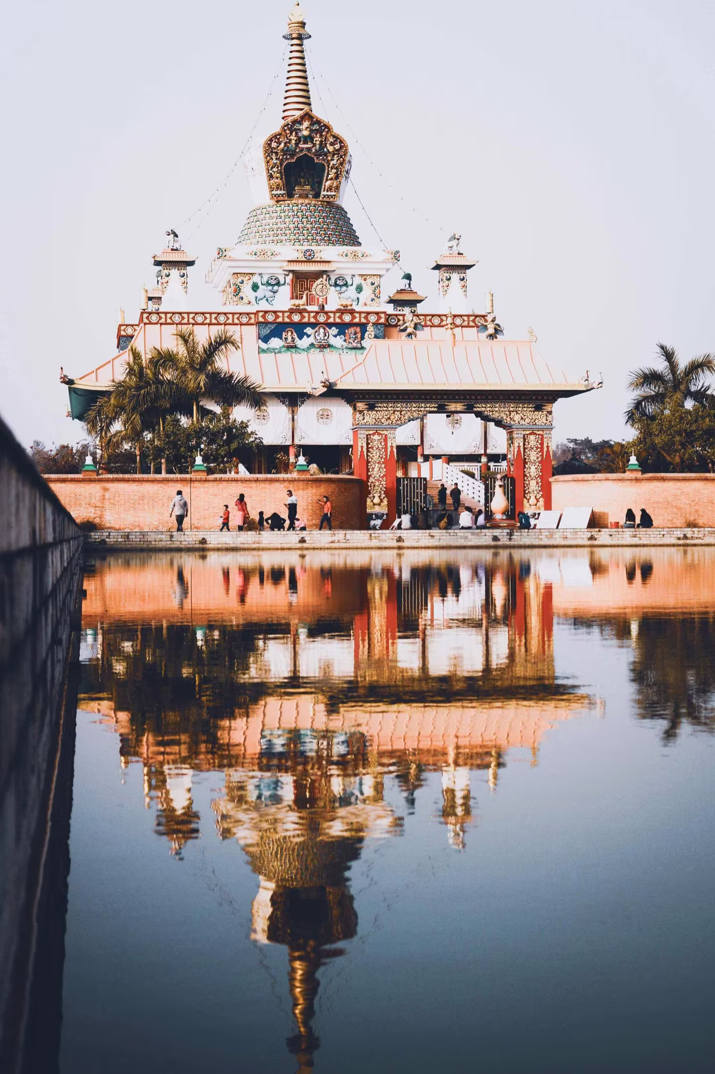 A lakeside temple mirrored in calm water
