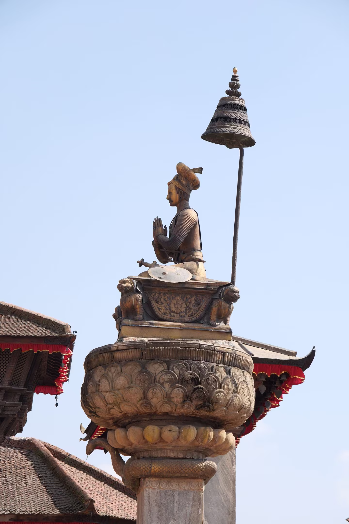 The statue of King Bhupatindra Malla on its stone pillar
